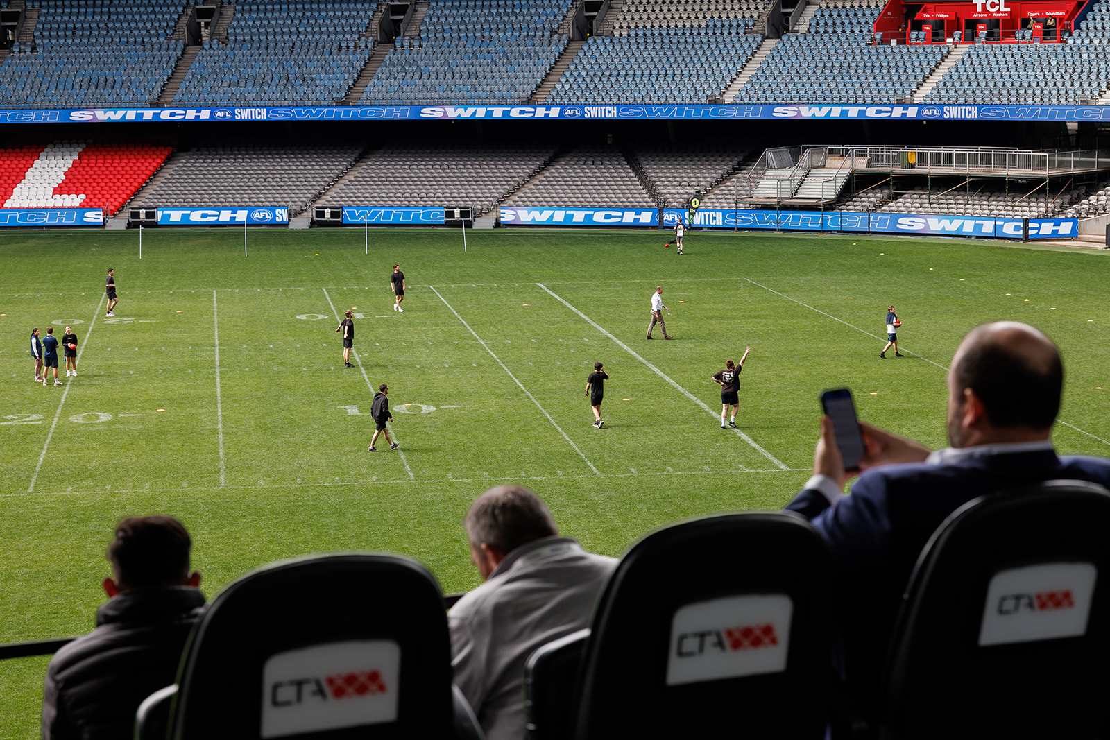 Delegates watching an on-field activity at Marvel Stadium